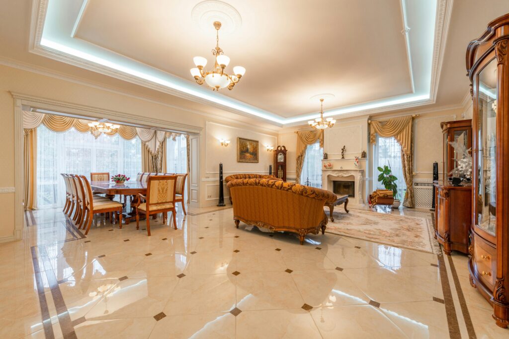 Spacious and elegant interior design featuring a luxe living room and dining area.